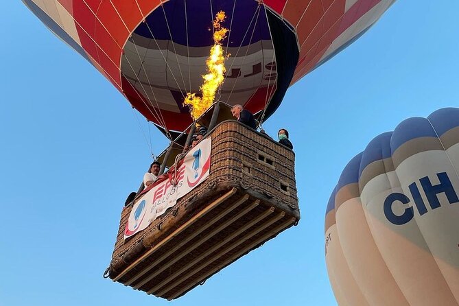 Cappadocia Hot Air Balloon Ride over Cat Valley with Transfers - Landing, celebration, and return to your hotel