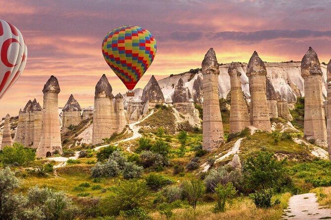 Balloons over the fairy chimneys at first light, Cappadocia