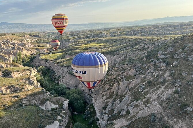 Cappadocia Sunrise Hot Air Balloon Ride | All-Inclusive Tour Cat - Watching the balloon come to life at Çat Valley