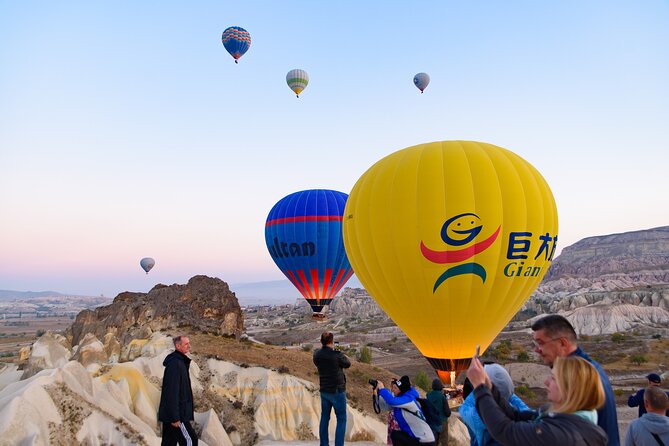 Cappadocia Sunrise Hot Air Balloon Watching Tour w/Transfer - Stop one: balloons preparing for takeoff
