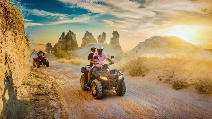 From Ürgüp/Göreme: Cappadocia Sunrise or Sunset Quad Tour - Red Valley: the first burst of color