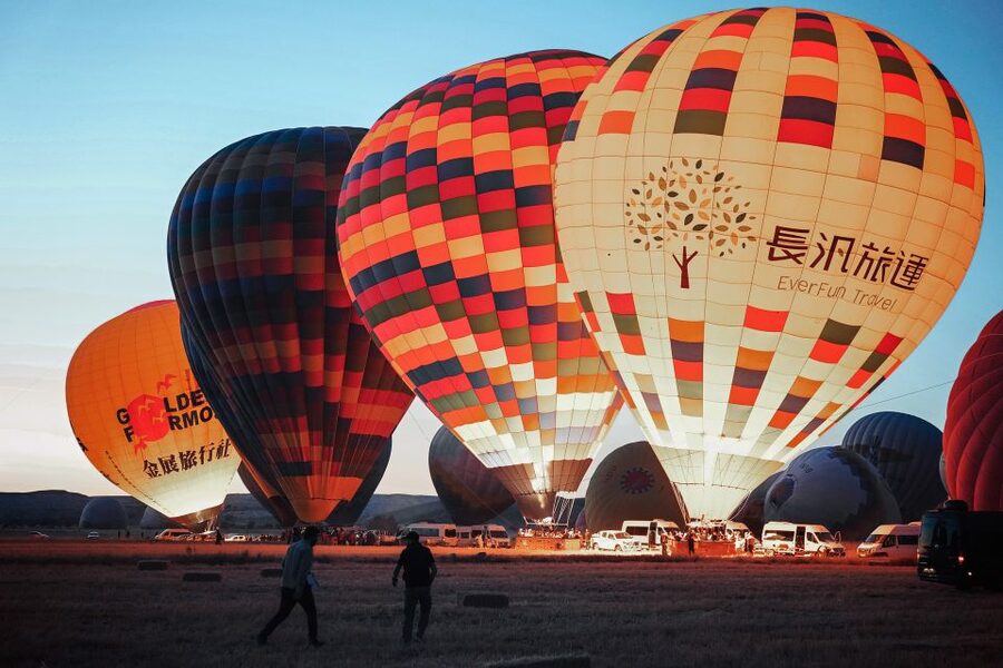 Hot air balloons in Goreme red valley - What the Small Group Means