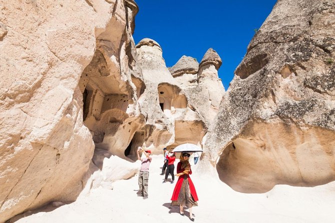 Only Guide and Van - Private Cappadocia Day Tour - Pigeon Valley explains the small holes in the cliffs