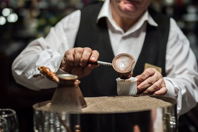 Sand-Brewed Turkish Coffee Workshop in Cappadocia - Grinding the coffee before the sand brewing